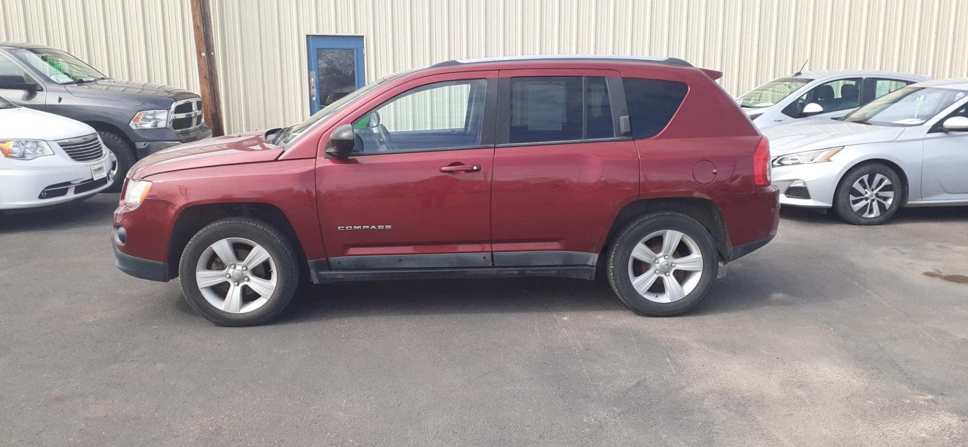 2011 Jeep Compass Sport FWD (1J4NT1FB0BD) with an 2.4L L4 DOHC 16V engine, 5-Speed Manual transmission, located at 2015 Cambell Street, Rapid City, SD, 57701, (605) 342-8326, 44.066433, -103.191772 - CARFAX AVAILABLE - Photo#0